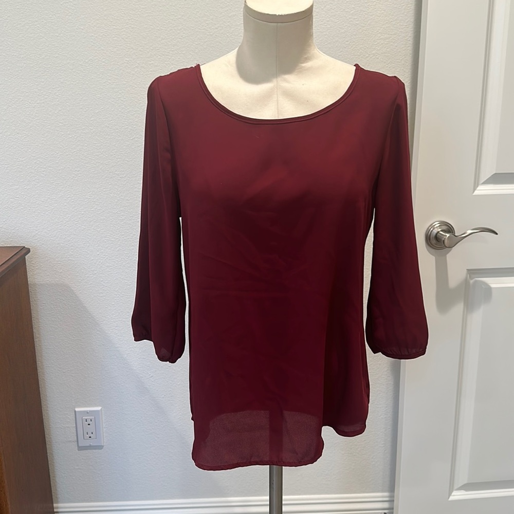 Jella Couture red blouse with back bow detail. Size Medium.